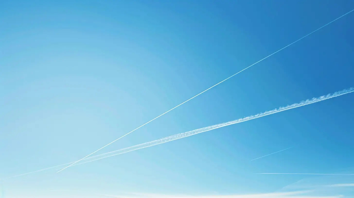 Vapor trail crossing a bright blue sky